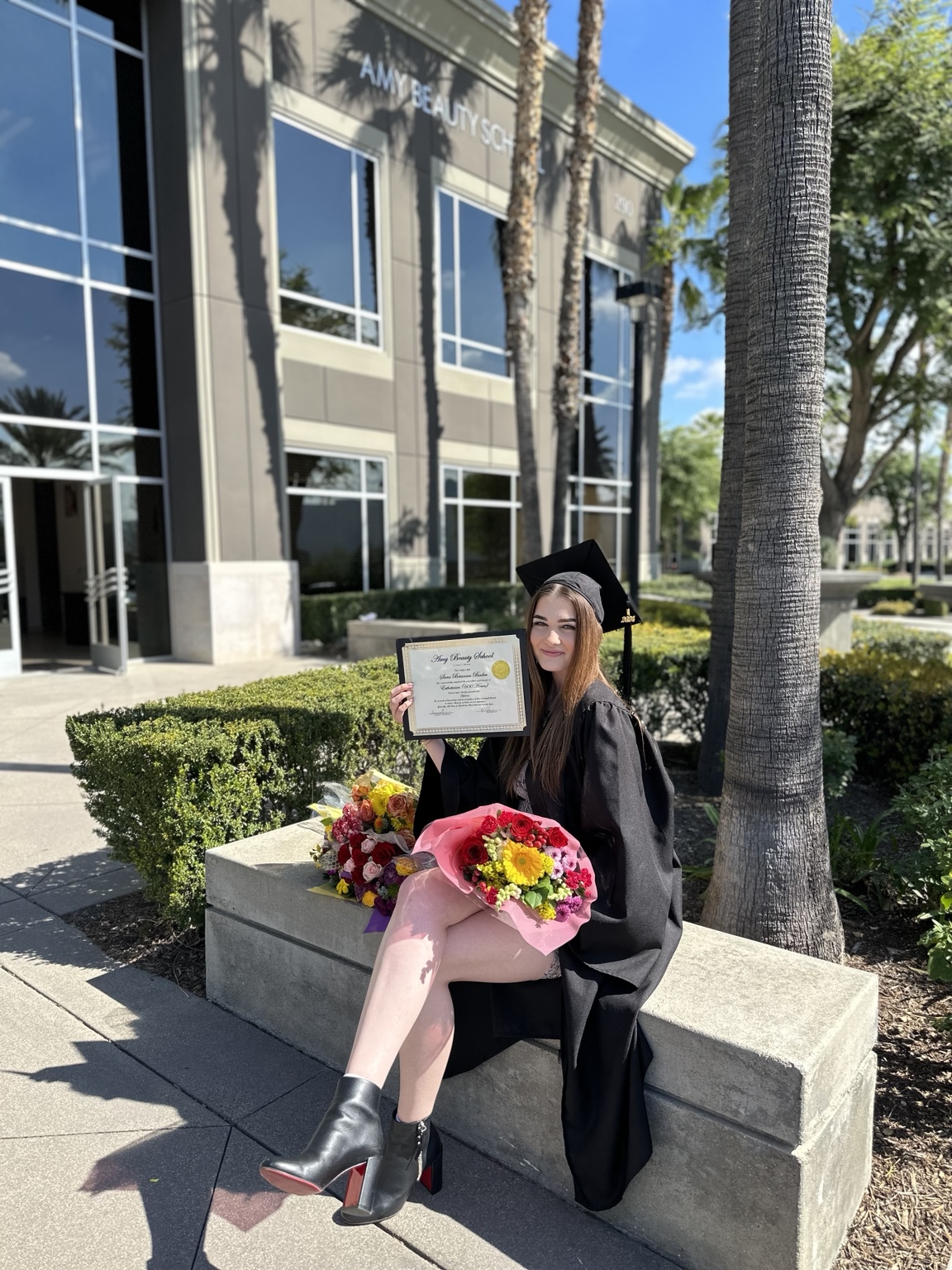 Sara celebrating her esthetics education