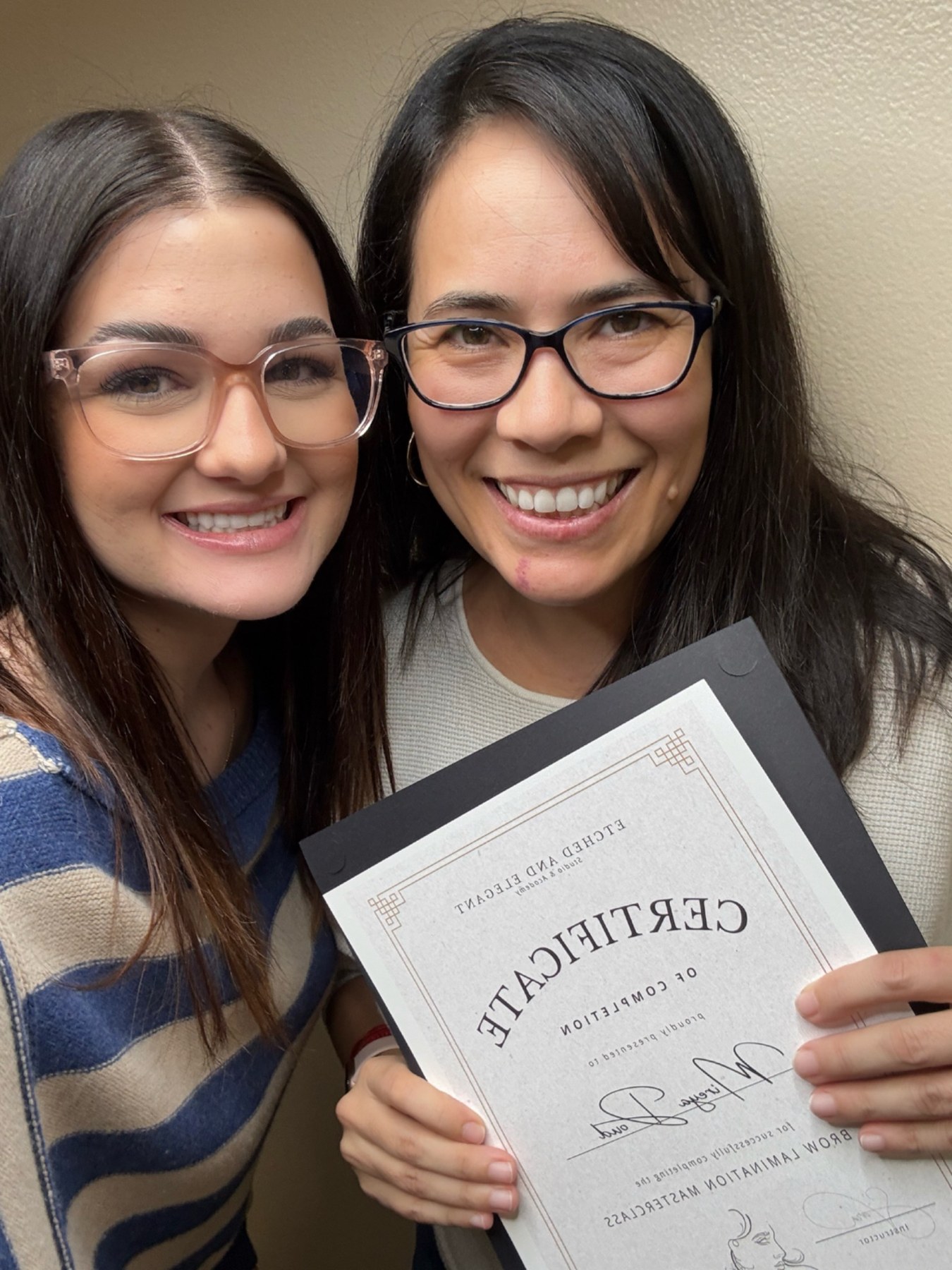 Sara with an ombré brow student and certificate